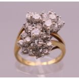 An 18 K gold diamond cluster ring. Ring size M. 8.1 grammes total weight.