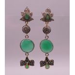 A pair of gold, diamond and chrysoprase stone drop earrings. 6.5 cm long.