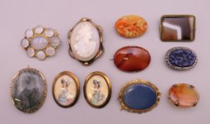 A quantity of various brooches. Cameo brooch 5.5. cm high.