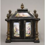 A 19th century Viennese enamel decorated ebonised miniature table cabinet. 12 cm high.