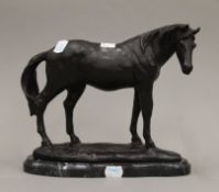 A bronze model of a horse. 22 cm high.