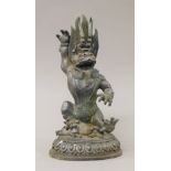 A Chinese bronze model of a mythical deity. 22.5 cm high.