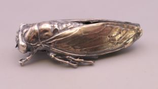 A silver locust form brooch. 4.5 cm long.