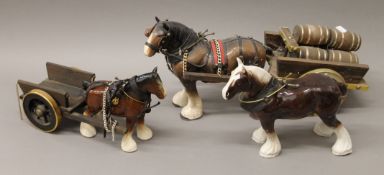 Three porcelain model cart horses and two carts.