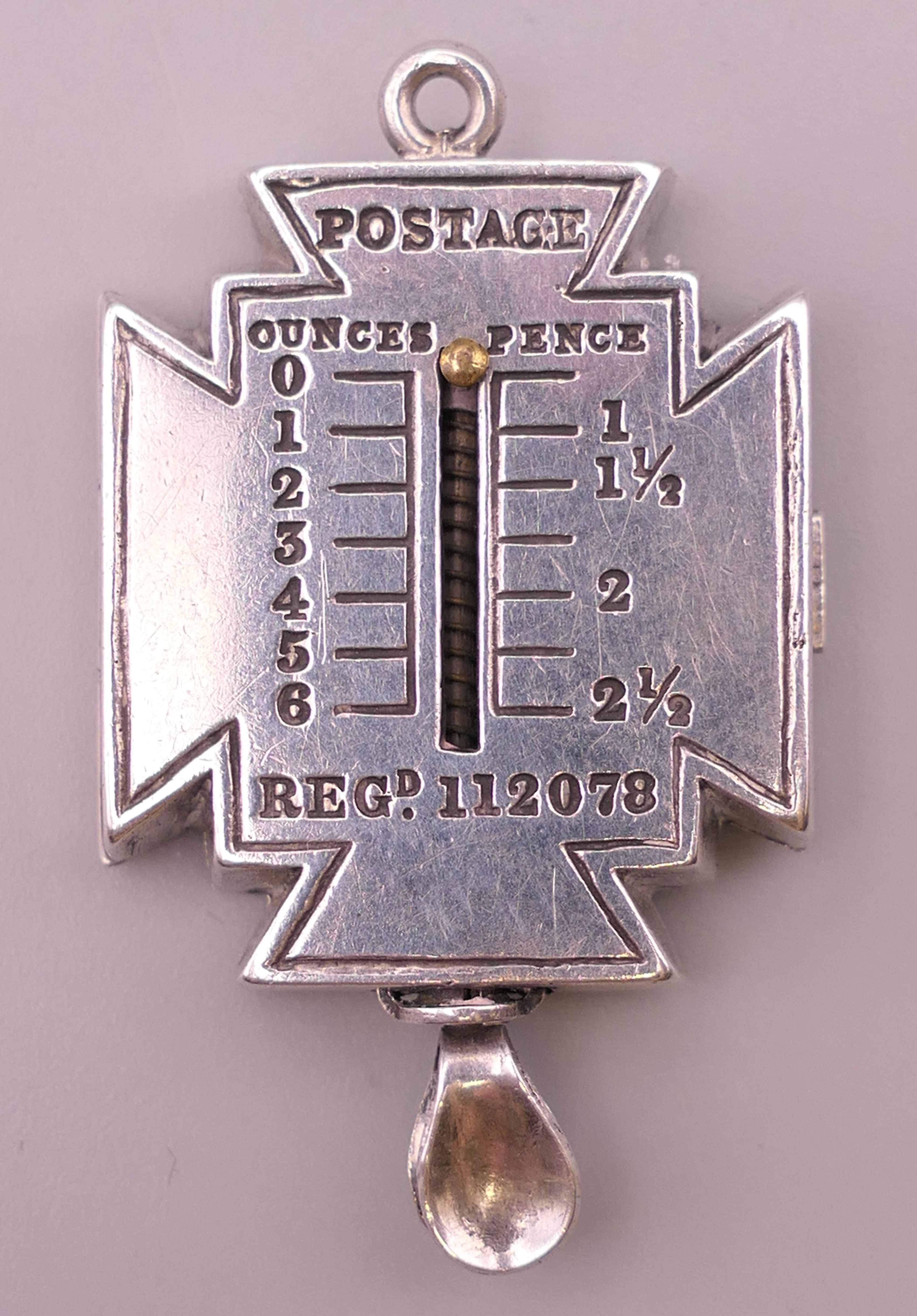 A rare silver Maltese cross form combined stamp case/letter scales, hallmarked Birmingham,