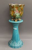 A majolica jardiniere and a majolica stand.