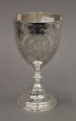 A Victorian embossed silver goblet. 15 cm high. 5.4 troy ounces.