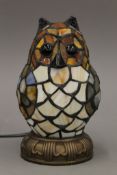 A Tiffany style owl form lamp. 19 cm high.