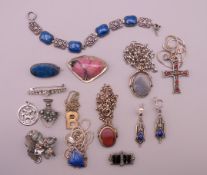 A quantity of silver jewellery, including brooches, bracelets and necklaces.