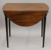 A 19th century mahogany Pembroke table. 48 cm wide flaps down.