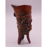 A small three footed libation cup. 8.5 cm high.