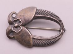 A small Georg Jensen silver brooch. 3 cm wide.