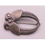 A small Georg Jensen silver brooch. 3 cm wide.