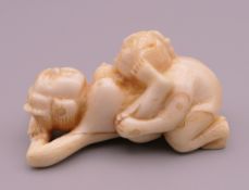 An erotic bone netsuke. 5.25 cm long.