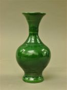 A Chinese green porcelain vase. 17 cm high.