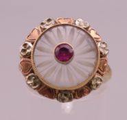 A 10 K gold crystal and ruby set ring. Ring size O/P. 4 grammes total weight.