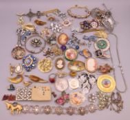 A quantity of costume jewellery, mainly brooches.