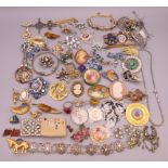 A quantity of costume jewellery, mainly brooches.