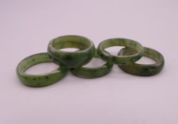 Five nephrite jade rings.