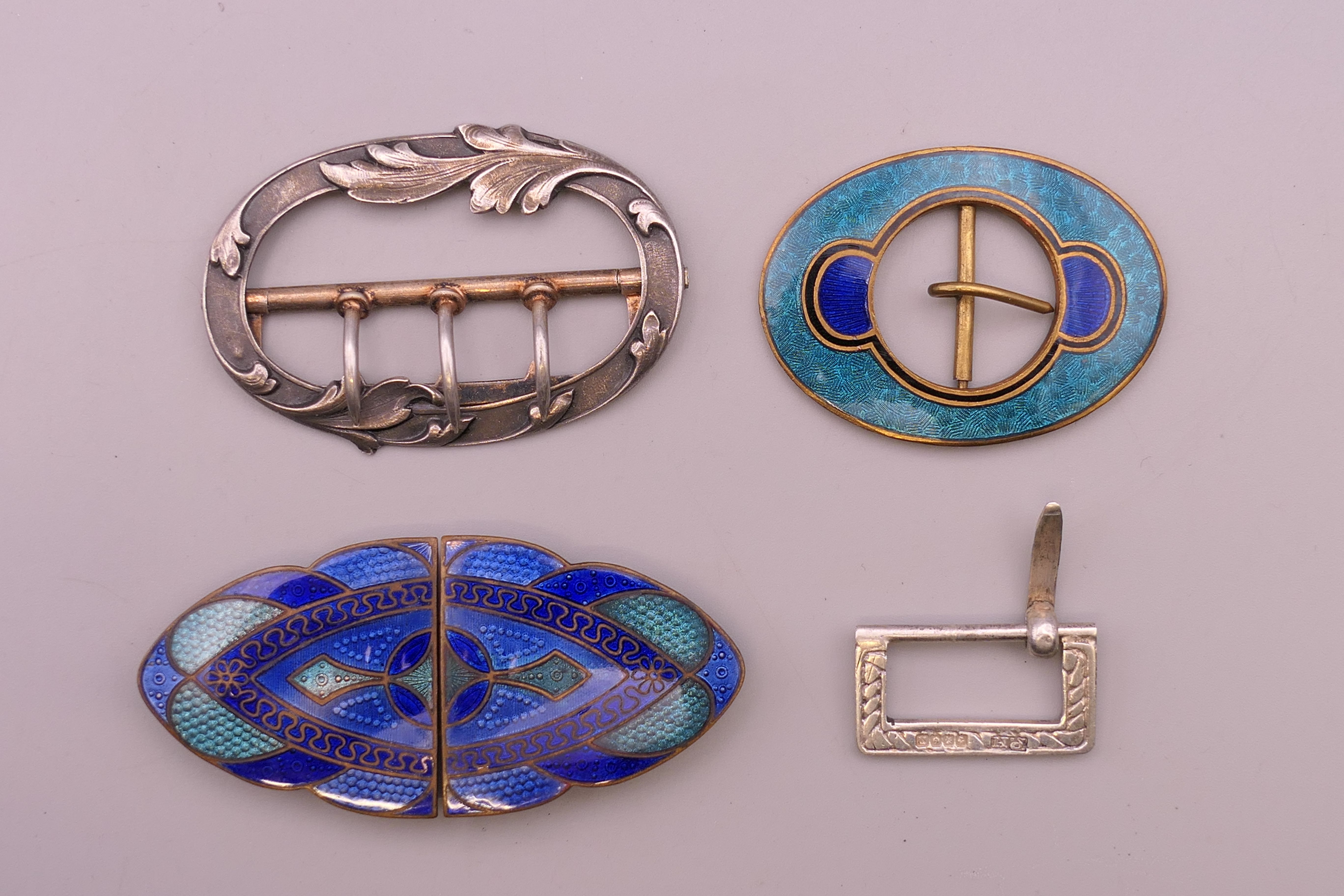 Four various buckles. Largest 7 cm long.