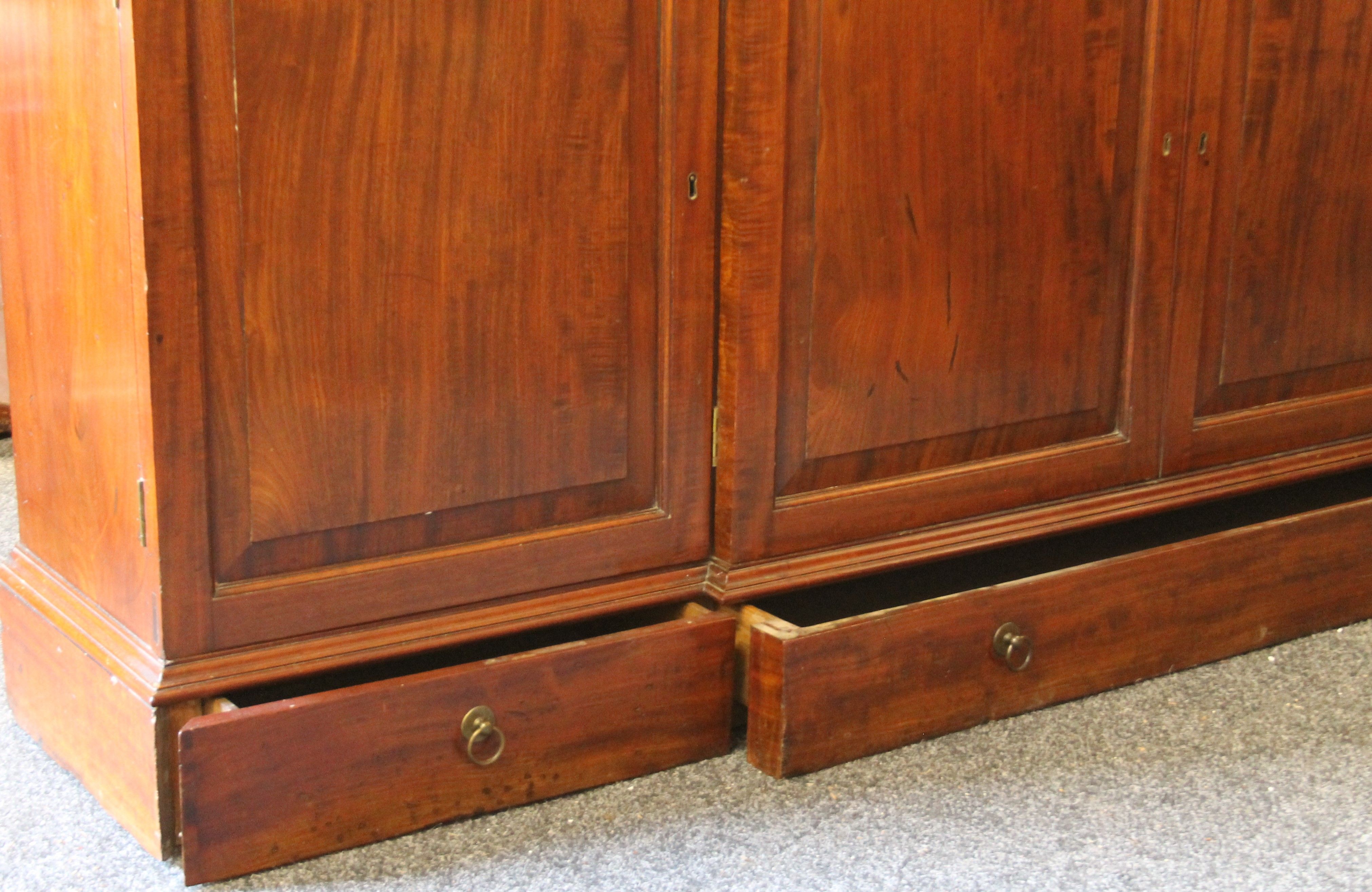 A near pair of early 19th century and later mahogany breakfront bookcases (one probably made to - Image 6 of 18