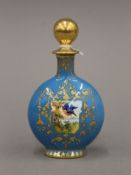 A Coalport blue ground porcelain scent bottle painted with birds. 10 cm high.