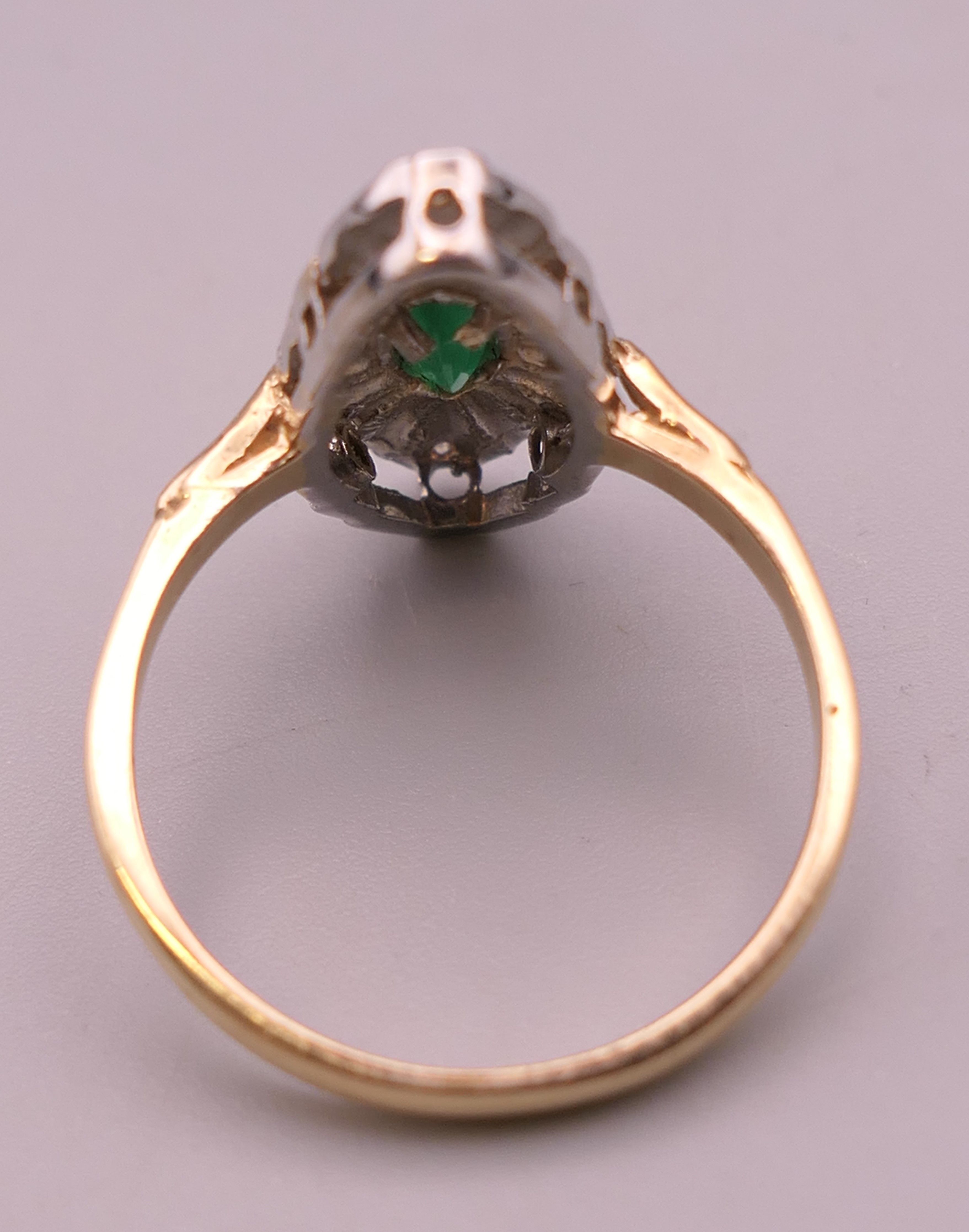 A 9 ct gold, emerald and diamond navette ring. Ring size T/U. 4.2 grammes total weight. - Image 3 of 5