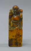 A soapstone seal. 12 cm high.