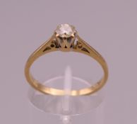 An 18 ct gold diamond solitaire ring. Ring size O. 2.5 grammes total weight.