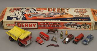 A boxed Derby Day game and a small quantity of toys. The former 67 cm long.