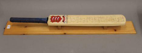 A signed Essex County Cricket Club bat, signatures including Ronnie Irani, Nassr Hussain,