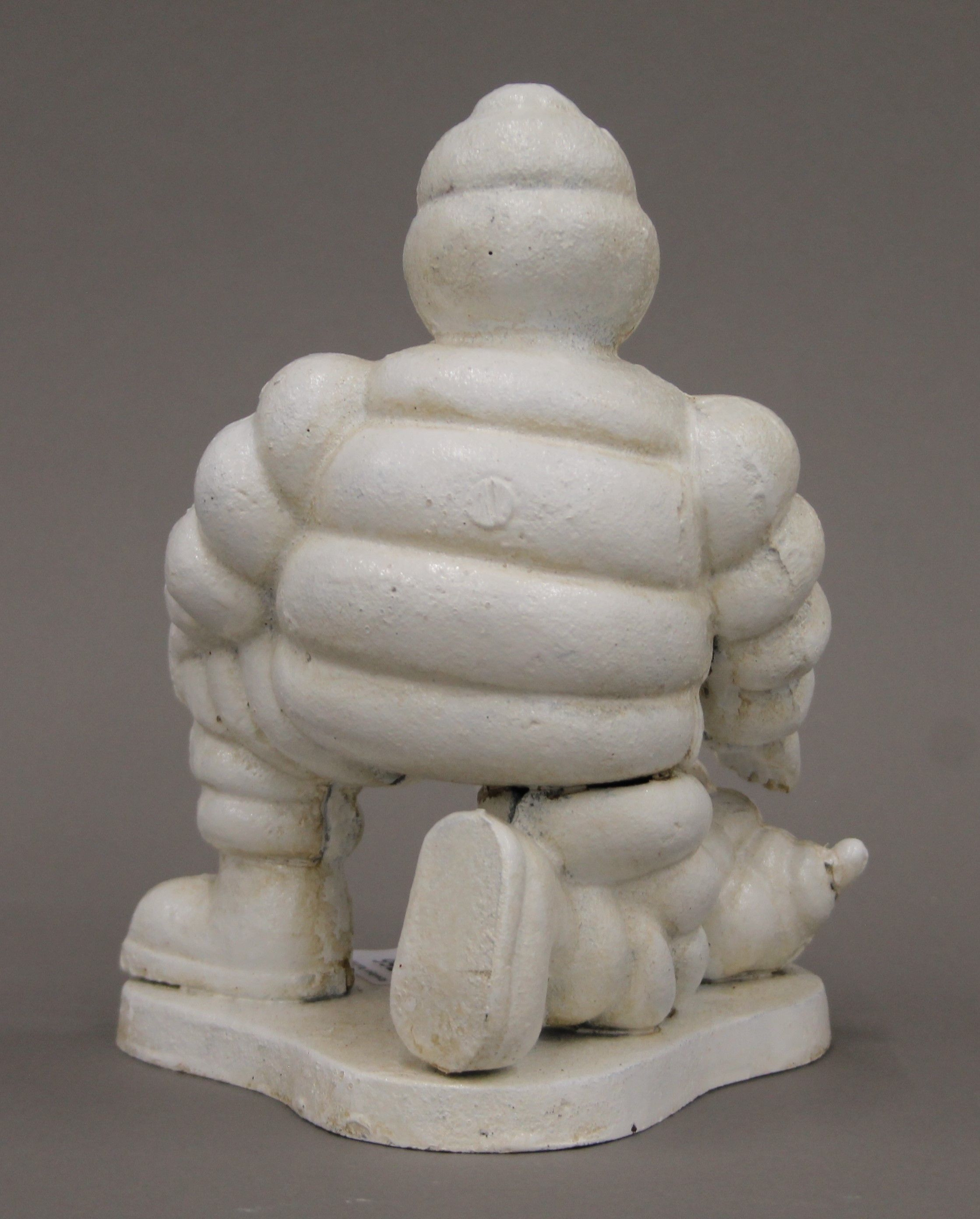 A cast iron Michelin Man and dog. 20 cm high. - Image 3 of 3