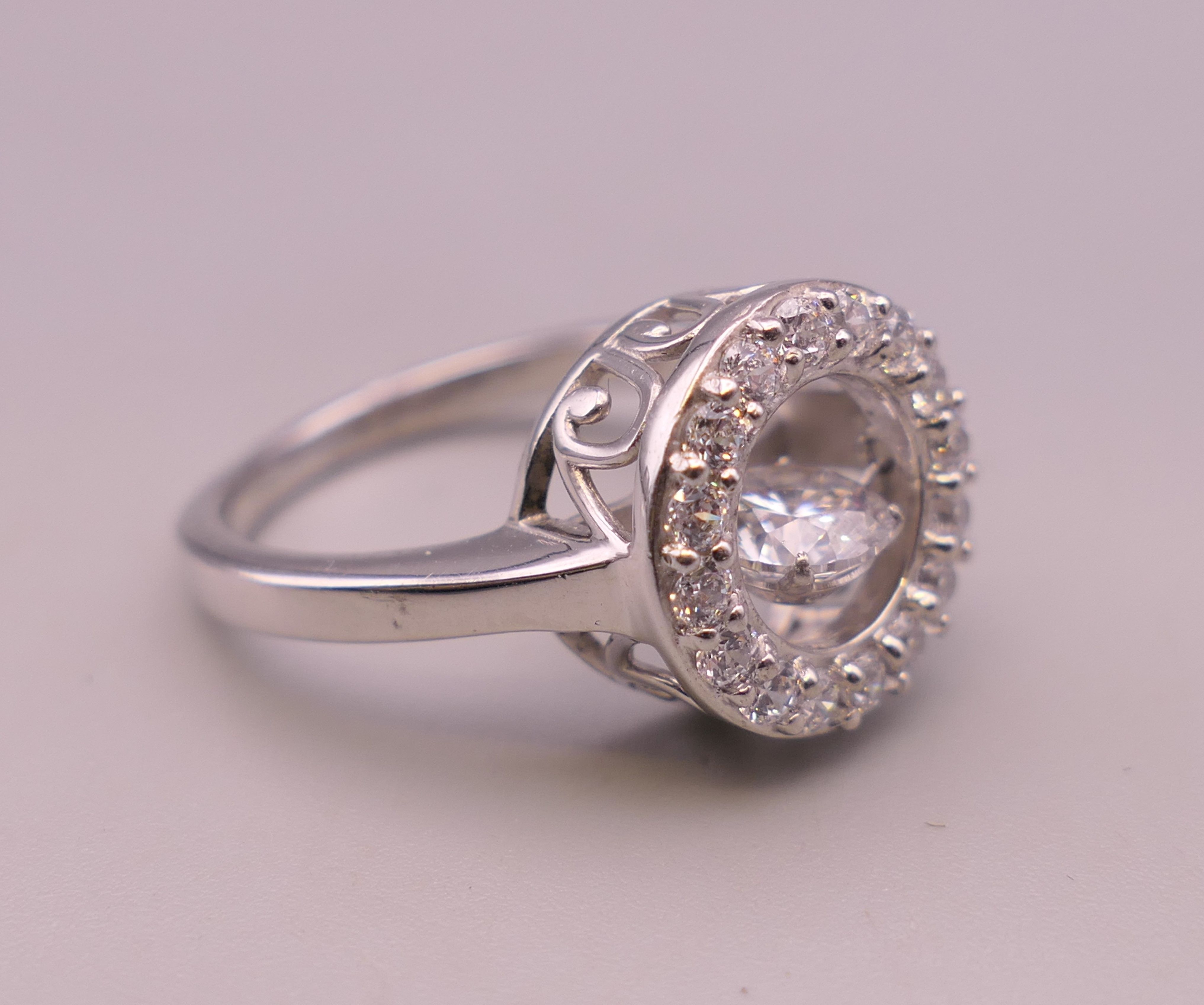 A silver 'swinging' central stone cubic zirconia ring. Ring size Q. - Image 3 of 4