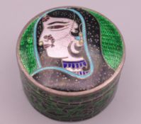 An Indian silver enamel box. 4.25 cm diameter.