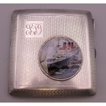 A silver cigarette case with roundel depicting a steam ship. 8 cm x 7.5 cm.