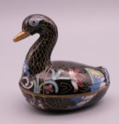 A Chinese cloisonne box in the form of a duck. 6 cm high.