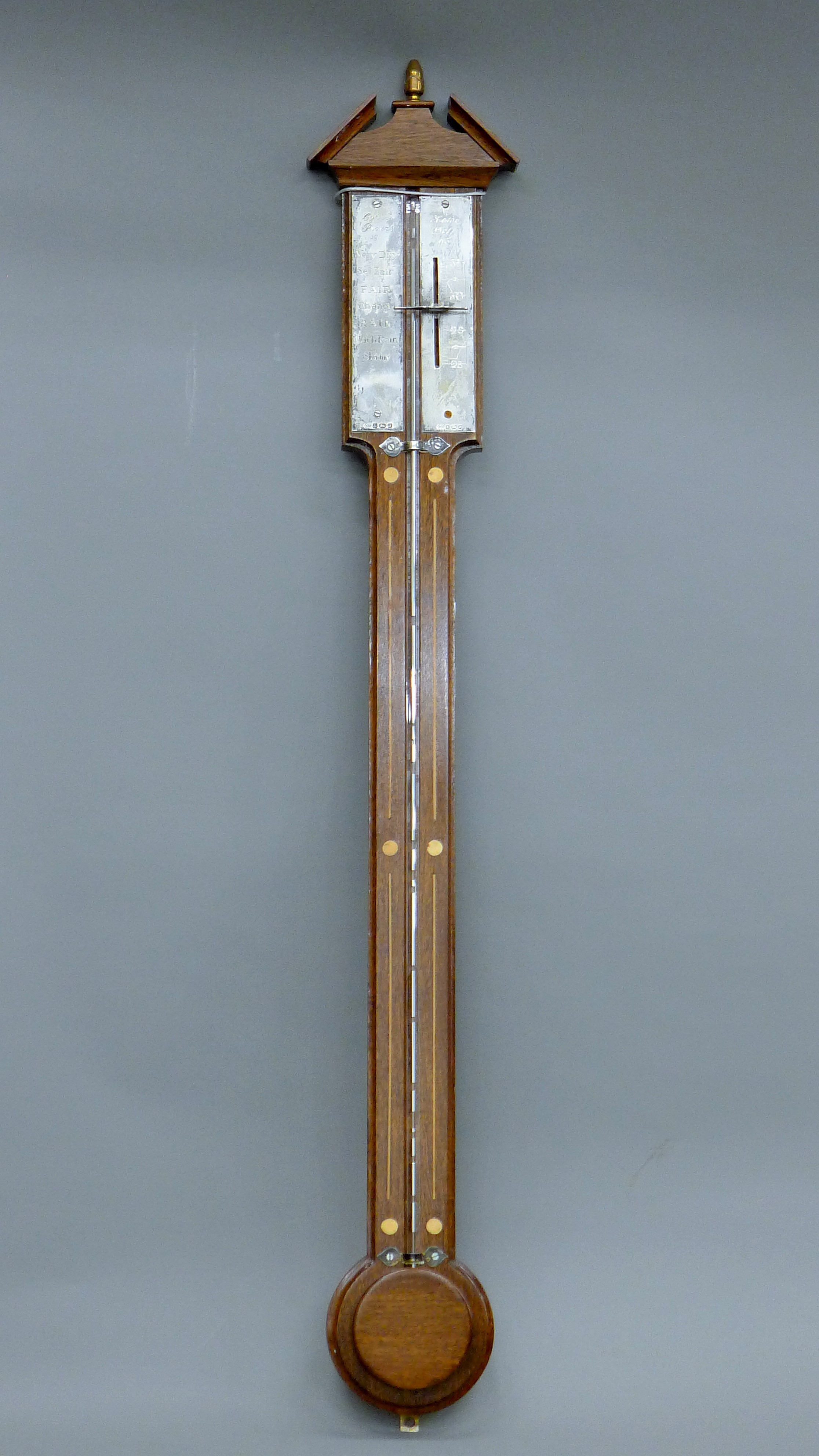 A silver mounted stick barometer.