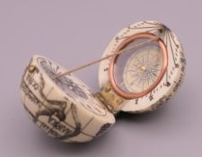 A bone globe form compass. 4 cm high.