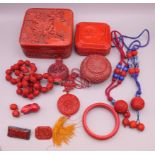 A quantity of various cinnabar lacquer items, including boxes, beads and a coral rabbit, etc.