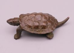 A bronze model of a tortoise. 6 cm long.