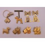 Eight 1930s gilt metal Scottie dog form brooches. Double Scottie dog brooch 3.5 cm high.