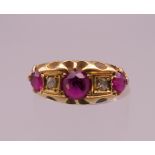 An 18 ct gold ruby and diamond ring. Ring size K. 3.1 grammes total weight.