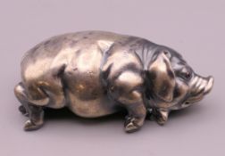 A silver model of a pig, bearing Russian marks. 7 cm long.