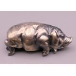 A silver model of a pig, bearing Russian marks. 7 cm long.