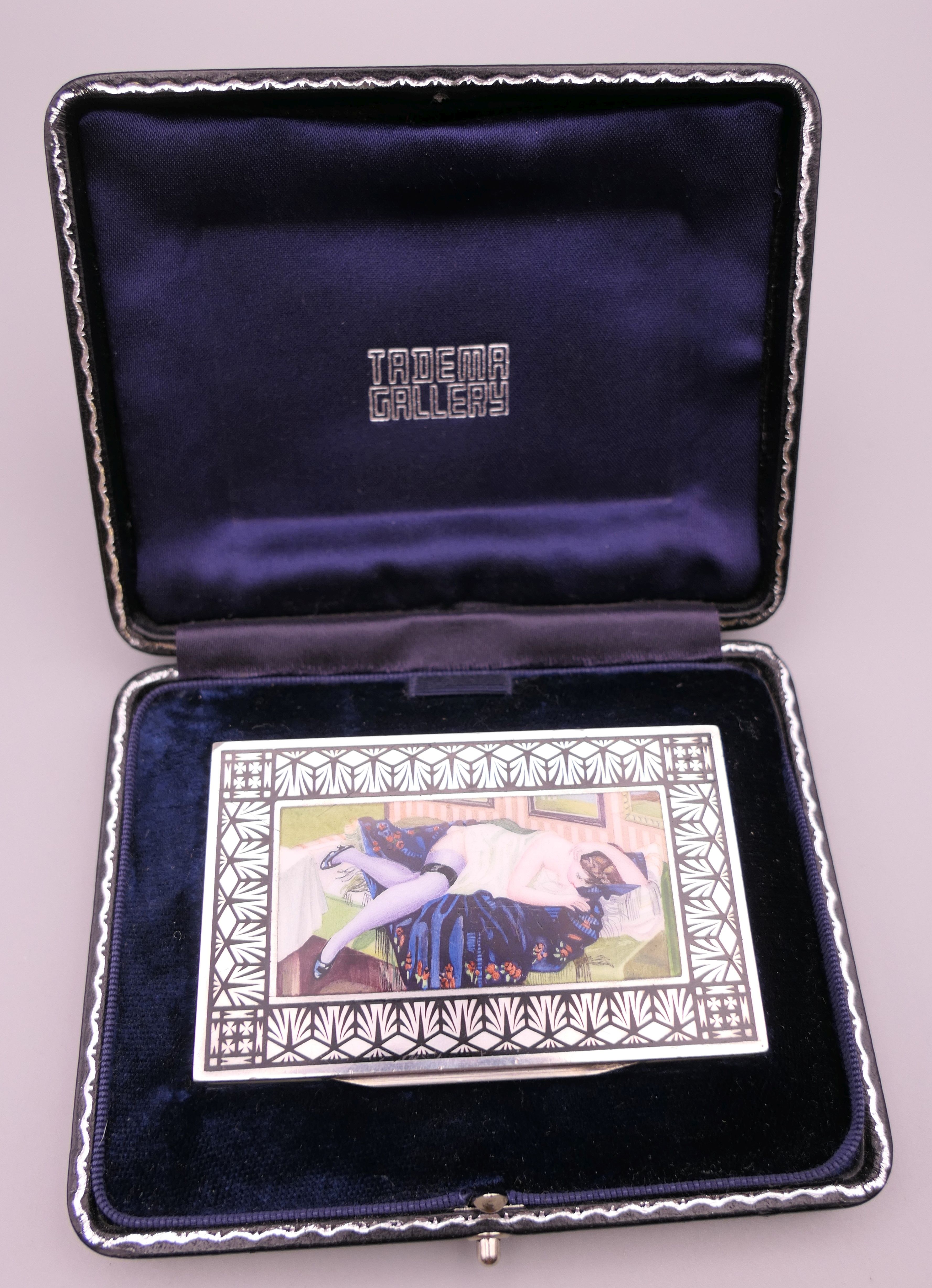 A Continental silver and enamel box, with lid depicting a reclining lady, in a Tadema Gallery box.