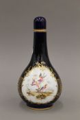 A Coalport porcelain flask vase painted with exotic birds. 23 cm high.