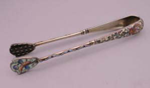 A pair of Russian silver and enamel tongs. 14 cm long.