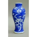 A 19th century Chinese blue and white prunus pattern slender vase, with double circle mark to base.