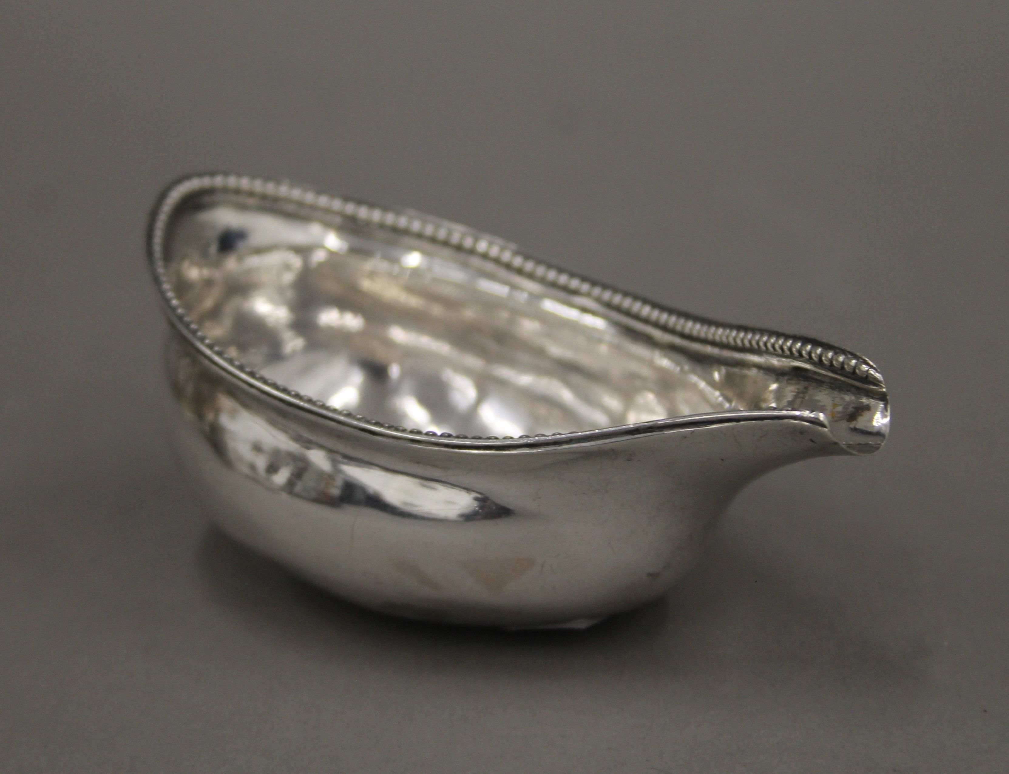 A Georgian silver pap boat. 10 cm long. 39.1 grammes.