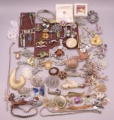 A quantity of silver and costume jewellery, including Scottish dirk brooches, etc.